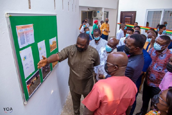 Education Minister, Dr. Adutwum, being taken around the NSS facility