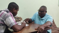 Mr Ashley (right) explaining a point to Ghanaian Times reporter