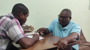 Mr Ashley (right) explaining a point to Ghanaian Times reporter