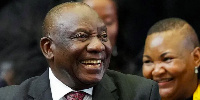 Cyril Ramaphosa reacts in parliament after being re-elected president