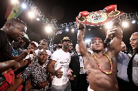 Isaac Dogboe displays his new title after winning the fight