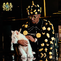 Nana Kwame Bediako with one of his two tiger cubs