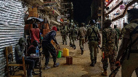 Ugandan police officers and members of Local Defence Units, patrol in the capital Kampala (AFP)