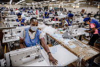 Workers in producing PPEs in a factory