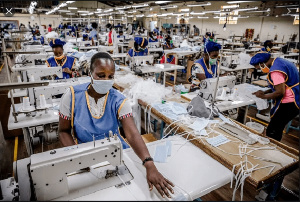 Workers in producing PPEs in a factory