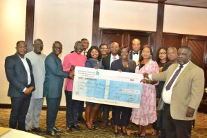 Labadi Beach Hotel Presenting Dividend Cheque To The Shareholder.png