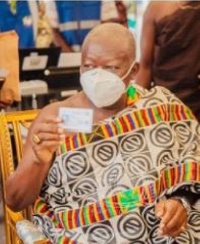 Asantehene, Otumfuo Osei Tutu II displaying his voter ID card