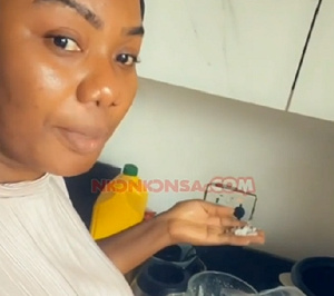 Bridget Otoo displaying her cooking skills