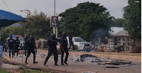 Police officers dispersing protesters in Nkoranza