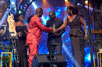 Daryl Bosu, Deputy National Director, presenting award to Isaac Tosu who received the award