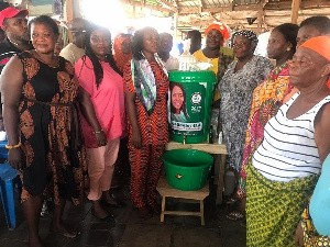 Hon. Odoley in a photo pose with some NDC executives and executives of La market women