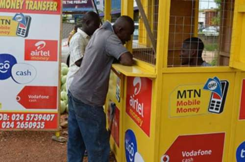 MoMo vendor attending to a  customer