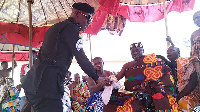 Chief Superintendent Kwame Tawia shakes hands with Barima Osei Hwedie II