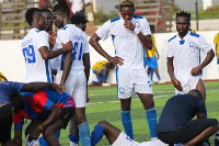 An Olympics player receives treatment on the pitch