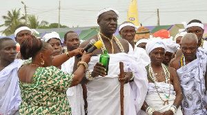 A traditional leader pouring libation