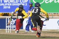 Two cricket players playing the game