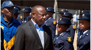 South-Africa's President Cyril Ramaphosa (R) and Police Minister Bheki Cele inspecting a guard of