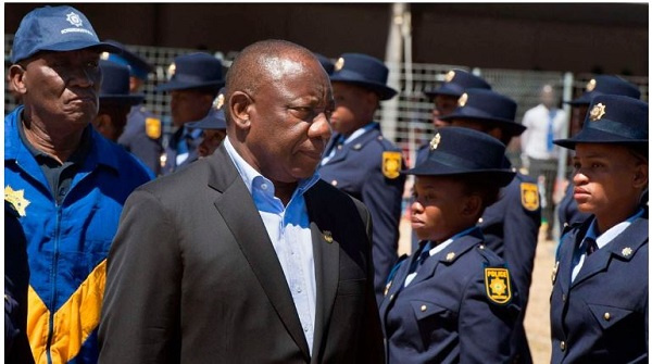 South-Africa's President Cyril Ramaphosa (R) and Police Minister Bheki Cele inspecting a guard of