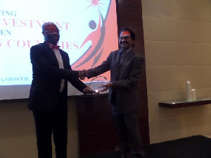 The First Sky Group Chairman Receiving One Of His Two Awards From Mr. Johnson