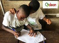 Pupils of AME Zion School brainstorming during a quiz competition