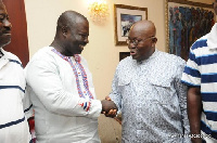 Deputy Eastern Regional Minister, Samuel Nuertey Ayertey in a handshake with President Akufo-Addo