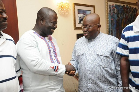 Deputy Eastern Regional Minister, Samuel Nuertey Ayertey in a handshake with President Akufo-Addo