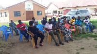 Community members sitting in a meeting with the MP