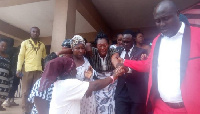 Nana Akua Bemah being consoled after the death of her son