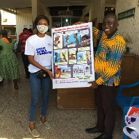 Frank Owusu Asare receiving the materials from the group