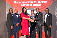 Staff and executives of Comsys Ghana with the award