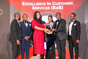 Staff and executives of Comsys Ghana with the award