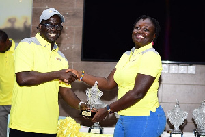 A winner receiving his trophy