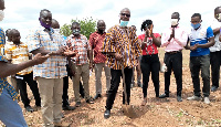 Mr. Daniel Kwame Gariba (in smock) breaking the ground for the construction of the factory.