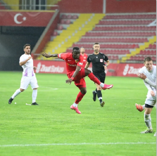 Ghana international Yaw Ackah in the red jersey