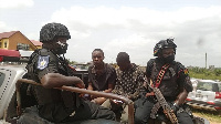 The two ‘Kasoa boys’ being escorted by the police