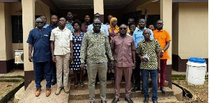 Mr Daniel Machator (middle) with staff of Nkwanta - South Municipal Assembly