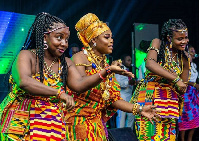 Joyce Blessing (M) performing the 'Adowa' dance on stage