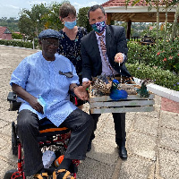 Gregory Andrews with former president, John Kufuor, and the peacock gifts