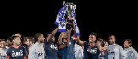 Gershon Koffie and New England Revolution celebrating their Desert Cup triumph