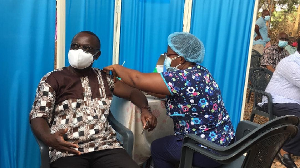 Prof. Ebenezer Oduro Owusu receiving the jab