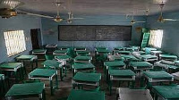 This photograph shows a deserted classroom at the Government Girls Secondary School