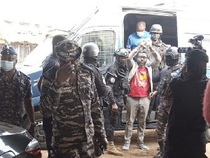 #FixtheCountry convenor, Mawuse Oliver Barker-Vormawor being escorted by armed police men