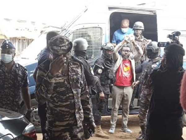 #FixtheCountry convenor, Mawuse Oliver Barker-Vormawor being escorted by armed police men