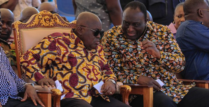 Akufo-Addo confers with Alan during a function