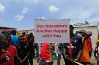 Arise Ghana demonstrators holding placards to indicate their grievances