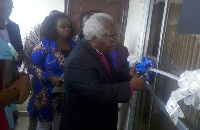 Most Rev. Prof. Emmanuel Martey cutting the tape to commission the hospital