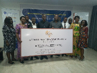 Members of International Needs Ghana with their certificate from AfCAA