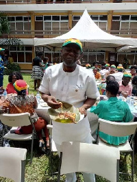 Ken Ofori-Atta eating his waakye at the 'Kenkey Party'