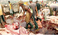 A butcher at a slaughter house