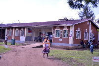 A woman leaves Kiyoni Health Centre III in Kyankwanzi District after receiving treatment